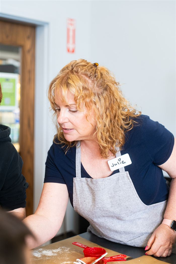 Instructor Julie teaching a cooking class